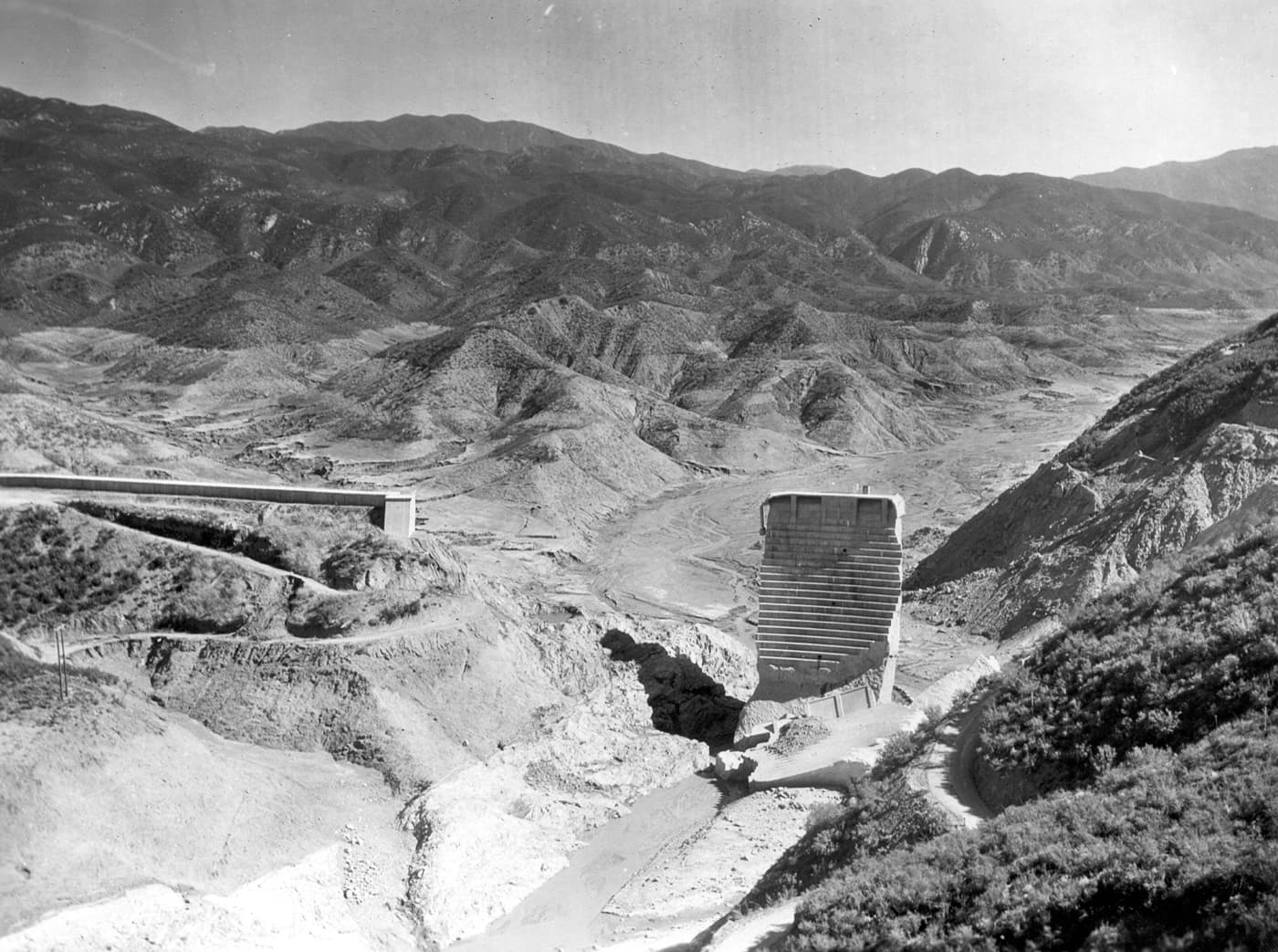 The "Tombstone", the surviving center section of the St. Francis Dam, photographed after the 1928 collapse.