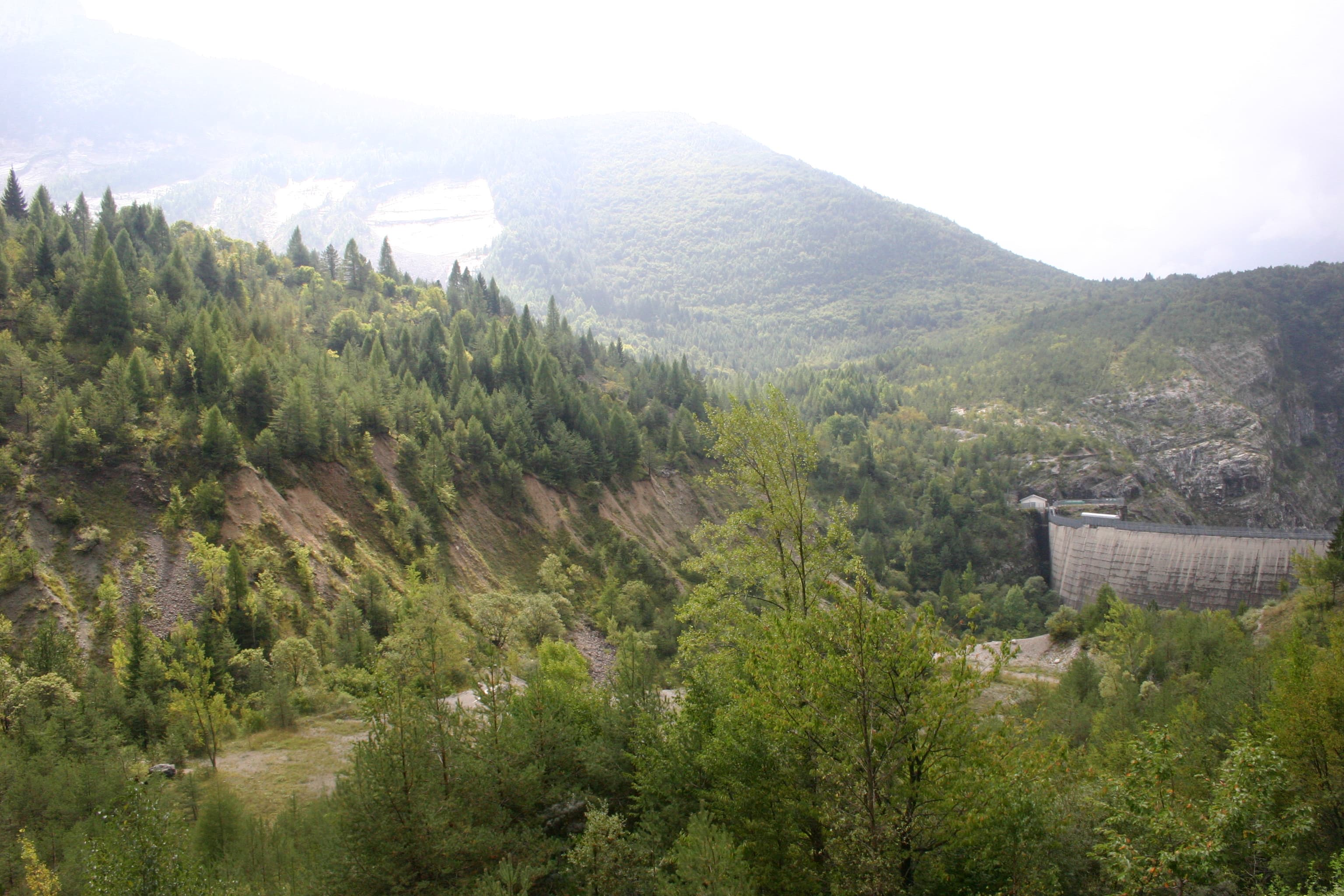 The Vajont Dam with the visible scar of the 1963 Monte Toc landslide on the far side of the reservoir.