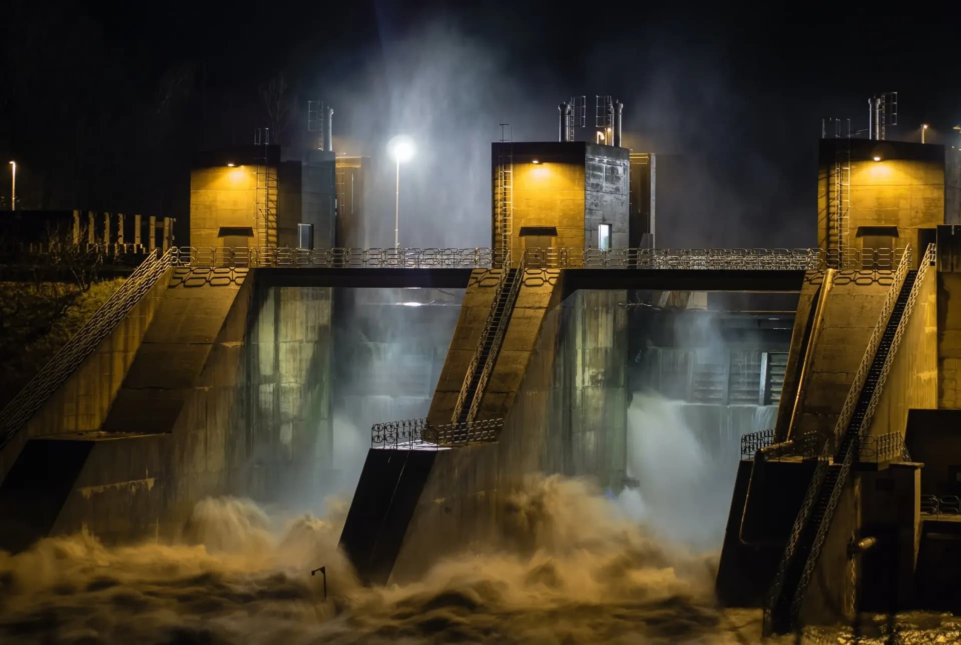 Dam outlet gates releasing water at night